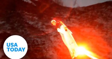 Skydiver uses flare during night jump to help guide him to the ground | USA TODAY