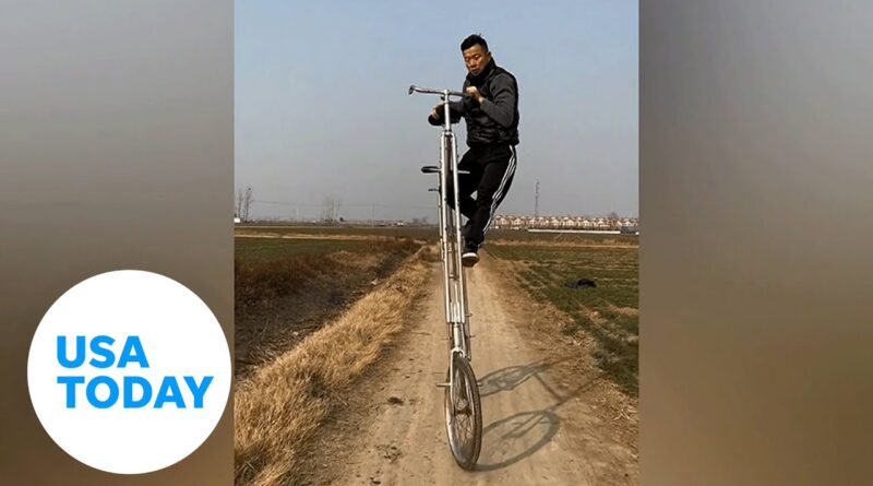Crazy video shows talented man climbing, riding bike over 9 feet tall | USA TODAY