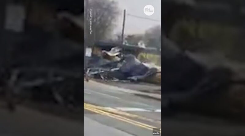 Tractor-trailer stuck on tracks slammed by oncoming train | USA TODAY #Shorts