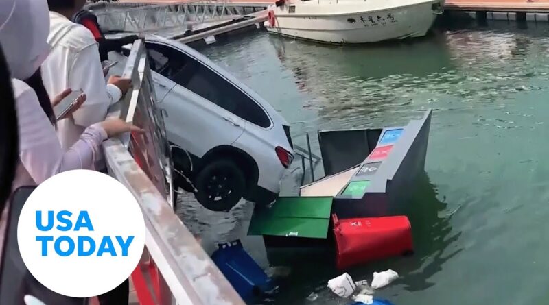 Chinese driver plunges his BMW into sea, gets out before vehicle sinks | USA TODAY